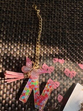 N beautiful brand new w tags bag charm with gold hardware